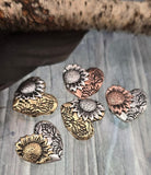 These sunflower heart 2‑hole slider beads combine romantic symbolism with artisan style. Each bead features a detailed sunflower on a heart-shaped base in antique brass, copper, or silver finishes. The coating is non‑tarnish and long‑lasting. Ideal as focal pendants or beads in necklaces and bracelets, they add rustic floral charm to artisan, boho, or handmade jewelry collections.