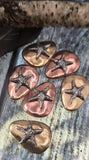 Celebrate the beauty of the sea with these handmade starfish 2‑hole slider beads. Each pebble‑shaped bead showcases a raised silver starfish on copper or brass antique‑style finishes. Dual‑hole placement ensures secure alignment whether used in bracelets, chokers, or pendant necklaces. Perfect artisan focal beads for nautical jewelry, coastal summer gifts, or handmade bohemian creations inspired by the ocean.