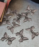 These artisan butterfly slider beads capture the delicate beauty of flight. With detailed wings in a bold antique silver finish, each bead includes two holes for stability in jewelry designs. Perfect as focals for necklaces, chokers, or centerpieces in bracelets, they’re meaningful supplies for bohemian, spring, or nature‑inspired jewelry collections, symbolizing renewal, freedom, and transformation.