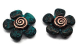 These mixed‑metal floral 2‑hole slider beads combine patina‑washed teal petals and spiral metallic centers, blending rustic charm with refined craftsmanship. Their true double‑strand design allows for balanced placement in bracelets and chokers. Used as focal sliders, spacer bars, or pendant connectors, they add artisan character and organic style to boho and spiritual jewelry designs.