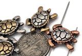 Turtle 2‑hole slider beads crafted with sculpted shells and outlines in antique silver, copper, and brass finishes. Their two‑hole structure ensures straight, secure threading in bracelets and necklaces. Balanced, durable, and symbolic, these sea turtle beads embody tranquility and longevity—perfect for bohemian, nautical, or tropical jewelry collections.