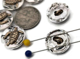 These mixed‑metal turtle 2‑hole slider beads combine radiant silver shine with detailed copper accents. Perfect for ocean‑themed jewelry, each bead’s double‑hole design ensures neat, symmetrical placement. Use them as focal beads, spacers, or connectors in double‑strand bracelets or necklaces. Includes six highly polished beads for coastal, boho, or gift designs.