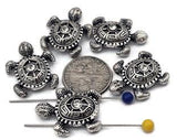 These silver sea turtle beads feature intricate detailing with sparkling rhinestone centers for added brilliance. Each bead displays a textured shell pattern and dimensional flippers, creating a lifelike marine look. Perfect for bracelet focals, pendants, or earrings in ocean, boho, or coastal jewelry. Durable and lightweight, they add a polished, artisan touch to beach‑inspired designs.