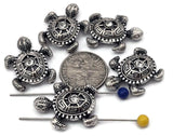 Shimmering silver turtle beads with crystal centers bring both sparkle and meaning to handmade jewelry. Their detailed shell carvings and textured flippers highlight beautiful craftsmanship. Perfect for bracelets, necklaces, or earrings inspired by ocean life. These little turtles pair perfectly with turquoise, coral, or sea glass accents for coastal or tropical themes.