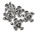 Bright silver turtle 2‑hole slider beads with carved swirl shells bring elegant marine style to artisan jewelry. Lightweight and reflective, they fit double‑strand bracelets, chokers, or necklaces perfectly. Ideal for adding symbolic ocean touches to bohemian, coastal, or mindful designs that embrace calm and connection.