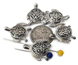 These Celtic turtle 2‑hole slider beads combine artistry and symbolism. Each bright silver bead displays interwoven knotwork across its shell, representing strength and eternity. Perfectly aligned for double‑strand bracelets and chokers, they’re versatile beads for bohemian, ocean, or heritage‑style jewelry designs that celebrate balance and endurance.