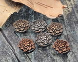 These teal patina mandala sliders are lightweight yet striking. The raised copper/silver floral design adds depth, while the two‑hole build keeps beads from twisting in bracelets and necklaces. Durable non‑tarnish metal resists wear. Ideal as focal beads for boho stacks, festival chokers, pendant centers, and statement earrings. Package of six 2‑hole beads.