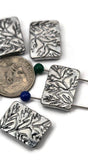 Organic branch/fern rectangle beads, 2‑hole sliders for thin beading wire and micro cord. These antique silver plant beads sit flat and won’t twist—ideal for seed‑bead projects, minimalist bracelets, and pendant centers. Avoid leather and chain. Lightweight, non‑tarnish metal. Set of five botanical rectangle beads.