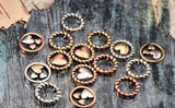 Elevate your baded designs with these round heart beads—distinctive 2 hole slider beads with a rope‑twist border and layered hearts. They’re metal beads that read boutique: bright, durable, and hypoallergenic. Ideal as centerpiece focal beads or for stacking multiples for texture. A must‑have metal finding for makers who want mixed‑metal style and instant gift appeal. Finish tones vary by package for an artisan look.