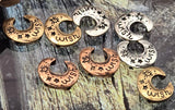 Make a wish with these crescent moon 2 hole slider beads. Each bead pairs a gently domed curve with crisp stamped stars and the word “wish.” Antiqued silver, copper, and brass finishes emphasize the artwork. Great as focal beads for bracelets and easy pendant centers on necklaces. A sweet, giftable motif for year‑round collections.