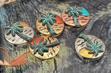 Beach theme 2 hole slider beads featuring a palm tree and sun. Round coin shape, textured waves, teal patina highlights. Mixed-metal finishes photograph beautifully. Perfect focal beads for bracelet stacks and pendant centers. Search terms: palm tree charm bead, coastal jewelry component, tropical summer bead, ocean sunset bead, metal focal bead.