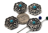 Vintage-style silver concho beads with turquoise stone accents. These two-hole slider beads have layered petals, rope borders, and oxidized shadows that pop in photos. Excellent focal beads for bracelet stacks or pendant necklaces. Keywords: turquoise bead focal, western concho slider, southwestern jewelry supplies, floral concho bead, metal coin slider.