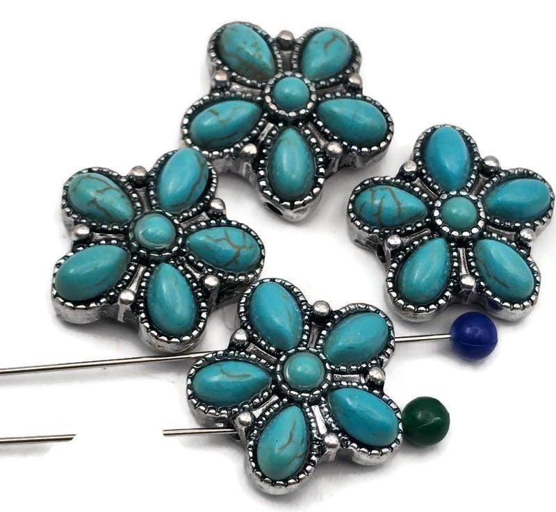 Bright turquoise blossom 2 hole slider beads with an antique silver finish. Each flower shows six smooth teardrop petals around a domed center, framed by dotted borders for western concho vibes. A vivid blue pop makes an instant focal bead for bracelets, necklaces, earrings, rings, zipper pulls, and candle decor. Southwest style, boho floral charm, turquoise focal that photographs beautifully.