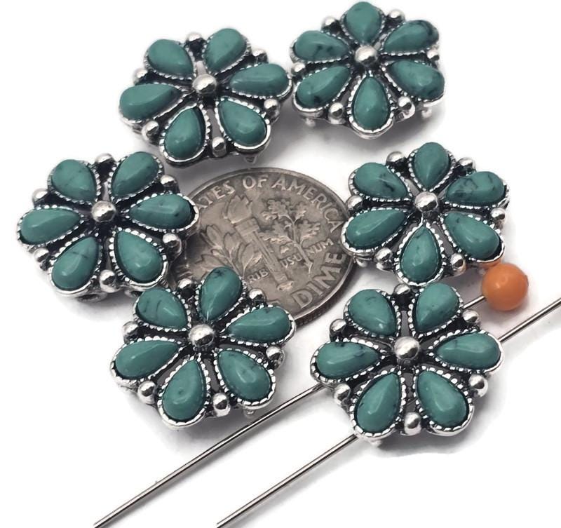 Western flower slider beads with 2 holes make bracelet and hatband building easy. Each floral concho-style slider features turquoise-look petals with antique silver details. Use as 2-hole slider beads for leather cuffs, loom bracelets, micro-macramé, and watch bands. Great for Southwestern jewelry making, bolo ties, and concho belts. Slide onto two strands for straight alignment and a secure fit that won’t spin.