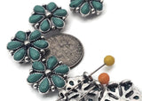 Southwestern flower 2-hole slider beads designed for leather and loom bracelets. The antique silver concho frame and faux turquoise petals bring cowboy-chic flair to hatbands, chokers, and boot straps. Dual holes let you slide over two strands for perfect alignment and comfort. Great focal slider beads for western jewelry makers and DIY craft projects.