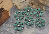 These two-hole slider beads feature a classic western flower motif with faux turquoise petals and antiqued silver accents. Great for 2-strand leather bracelets, loom work, peyote bands, and hatbands. The dual holes prevent twisting so designs stay straight. Use as focal slider beads for Southwestern jewelry making, bolo cords, and concho-style belts. Easy to string, bold to wear.