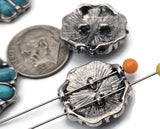 These 2‑hole slider beads showcase a daisy‑style flower with faux turquoise cabochons. Antique silver plating creates classic western detail. Slide over two strands for straight alignment—great for loom work, leather cuffs, and layered chokers. Use as focal beads, spacer beads, or statement metal beads. Must‑have findings for Southwestern jewelry and concho belt accents.
