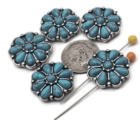 Western flower 2‑hole slider beads with turquoise‑look petals and antique silver frames. Use as focal beads, spacer beads, or metal beads in leather cuffs, loom bracelets, and hatbands. Dual holes keep two strands aligned for flat, stable designs. Ideal findings for Southwestern jewelry making, bolo ties, and chokers. Great for DIY kits and concho‑style projects that need a bold centerpiece.