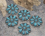 Western flower two‑hole slider beads deliver instant cowboy‑chic. Turquoise‑tone stones pop against oxidized silver metal. Run two strands of leather or beading wire through the parallel holes for a no‑spin fit. Ideal focal beads for bracelets, bolo tie centers, and concho‑style hatbands. Versatile jewelry findings and spacer beads for Southwestern designs.