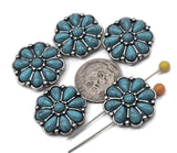Western flower two‑hole sliders bring turquoise color and silver detail to any project. The double‑hole channel keeps patterns straight for loom work, peyote bands, and leather cuffs. Use as focal beads for bracelets, pendants for chokers, or as wide spacer beads between gemstone strands. Versatile metal beads and essential findings for Southwestern jewelry designers.