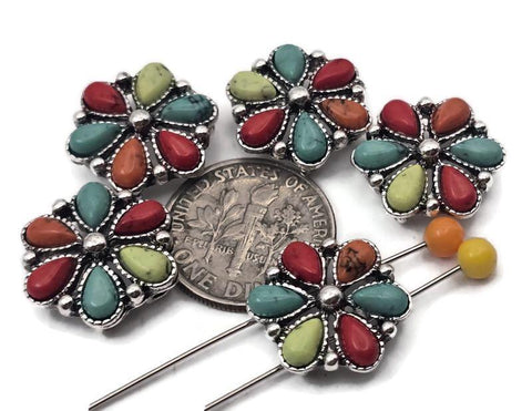 Southwestern flower 2-hole slider beads with multicolor turquoise-look petals. These concho-style metal beads make perfect focal beads for bracelets, hatbands, and chokers. Dual holes keep two strands aligned—ideal for leather cuffs, loom bands, and peyote strips. Use as spacer beads or statement findings in Western jewelry. Colors pop against antique silver, delivering instant rodeo and festival flair.