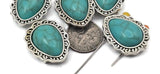 Southwestern 2-hole slider beads with cabochon turquoise stones. These focal beads shine on leather bracelets, layered necklaces, and loom bands. Dual holes support two-strand construction for a straight, stable fit. Use as statement bracelet beads or pendant-style necklace beads. Versatile jewelry making beads and findings for cowgirl, boho, and festival looks.