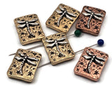 Dragonfly 2 hole slider beads for bracelets and necklaces. Rectangular gold and copper metal with raised silver dragonfly and star accents. Slide double strand design with small parallel holes for fine beading wire or thread. Great unique spacer/filler DIY components and focal beads. Bulk wholesale metal supplies for jewelry making—cheap sliderbeads from an online bead shop. Package of 6 new crafting parts.