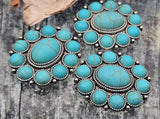 Round turquoise cabochon 2‑hole sliders in ornate rope‑edge concho settings. Small‑hole double‑strand channels keep strands flat and centered—ideal for structured bracelets, chokers, and pendant necklaces. Silver metal focal beads that deliver Southwestern/boho style. Great for Etsy sellers and kit builders seeking bulk wholesale metal components and cheap sliderbeads that look artisan.