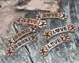 Dog bone slider beads with paw prints, LOVE heart, BARK paw. 2 hole small‑hole spacers for double 2‑strand bracelets necklaces. Silver‑tone plus copper/bronze accents. Pet jewelry components, DIY supplies, unique spacer filler, artisan charms, wholesale metal findings, cheap sliderbeads, dog mom stacker bracelet pieces.