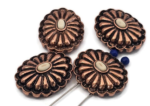 Antique copper concho 2 hole slider beads with raised scalloped petals and cream oval cabochon center. Large round rosette focal beads for bracelets and necklaces. True slide double‑strand design; small parallel holes fit fine beading wire, FireLine, or micro cord (not leather/chain). Jewelry making supplies, components parts, artisan beads, unique spacer filler, bulk wholesale metal, cheap sliderbeads.