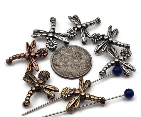 Whimsical dragonfly 2‑hole slider beads in mixed metals. Each bead features detailed wings and a tiny flower head, perfect as focal beads on double‑strand bracelets or chokers. Small parallel holes keep thin strands aligned and flat—great with fine beading wire, FireLine, or micro cord. Lightweight insect beads for crafting bracelets, nature jewelry, and boho gifts.