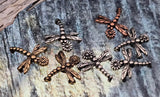 These small dragonfly sliders make sweet focal beads for stacking bracelets. The bodies are dotted for texture and the wings are etched with veins for a lifelike look. Two small holes keep strands flat and balanced. Lovely for nature‑inspired jewelry, crafting bracelets for gifts, and easy DIY kits.