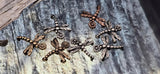 Use these dragonfly beads to anchor seed‑bead weaves or gemstone strands. The small channels run parallel so the insect sits flat and centered. Their lightweight design makes comfortable everyday jewelry. Wonderful components for bracelets, necklaces, and earrings with a garden feel.
