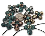 Vintage‑style filigree sliders with verdigris accents. The quatrefoil shape sits comfortably on the wrist and makes an eye‑catching bracelet focal. Double‑strand slide construction creates a flat, professional fit on thin strands. Essential components for jewelry designers, bead weavers, and makers building quick‑sell collections.