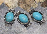 These antique silver metal 2 hole slider beads showcase vibrant faux turquoise in a Western concho frame. Double holes plus helpful guide loops on the back keep strands positioned for smooth stringing or bead weaving. Make eye-catching bracelet focals, pendant connectors, and earring centers, or wire wrap them for a rustic look. Pair with seed beads and other beads. Unique beading components; lead and nickel compliant.
