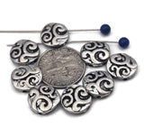 These swirl coin 2 hole slider beads deliver instant texture and shine. The domed disc profile sits flat and centered on double strands, perfect for statement cuffs and horizontal pendant bars. Pair with seed beads, gemstones, or heishi for festival stacks and everyday pieces. Antique silver finish coordinates with stainless, sterling, and rhodium findings.