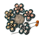 Design floral bracelets fast with mixed‑metal 2 hole slider beads. The teal patina outline surrounds dappled silver, gold, or copper petals for artisan texture. Dual channels align strands for bead‑woven straps or simple stringing, then taper with seed beads for clean spacing. Great as pendant connectors and lightweight earring centers. Versatile spacer/connector components and metal beads for coastal, garden, and festival jewelry.