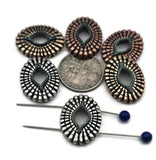 These textured oval sliders deliver instant artisan style. The radiating lines and patina center create a striking focal slider for bracelets and layered chokers. Mix metals for curated stacks or feature one bead as a pendant bar centerpiece. Great for festival jewelry, DIY kits, and giftable sets your customers search for by “2 hole slider beads.”
