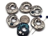 Inspirational Wisdom donut 2‑hole slider beads in antique silver with teal verdigris accents. Each bead features engraved lettering, a raised star, and a sparkling crystal detail. Use as bracelet focal, double‑strand spacer, or pendant bar connector for necklace designs. Perfect for yoga, meditation, boho, and meaningful jewelry that inspires mindfulness, clarity, and creativity.