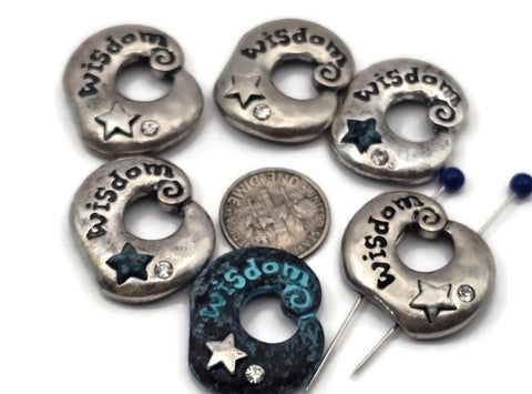 Inspirational Wisdom donut 2‑hole slider beads in antique silver with teal verdigris accents. Each bead features engraved lettering, a raised star, and a sparkling crystal detail. Use as bracelet focal, double‑strand spacer, or pendant bar connector for necklace designs. Perfect for yoga, meditation, boho, and meaningful jewelry that inspires mindfulness, clarity, and creativity.
