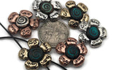 Inspirational floral 2‑hole slider beads combining rustic patina with engraved words of positivity. Crafted in mixed metal tones—silver, copper, and brass—they feature raised petals around a spiral teal core. Designed for clean, flat alignment in double‑strand bracelets and chokers, these beads are perfect for jewelry celebrating nature, mindfulness, and joy.