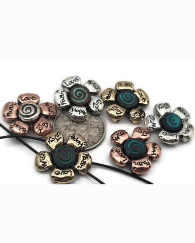 These flower 2‑hole slider beads blend spiritual symbolism with timeless craftsmanship. Each bead features engraved affirmations—Faith, Hope, Love, Joy—radiating from a teal spiral center. The antique silver, copper, and brass finishes create a warm, handcrafted look. Built for durability and comfort, their balanced double‑strand design makes them perfect focal beads, spacers, or pendant connectors in meaningful, inspirational jewelry creations.