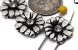 Floral 2‑hole slider beads designed with radiating petals and a crystal accent for subtle brilliance. The aged silver finish accentuates depth, making each bead ideal for double‑strand bracelets, pendant bars, and layered chokers. Durable and polished, they add playful yet sophisticated floral detail to contemporary jewelry.