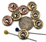 Paw print 2‑hole slider beads with antique silver detailing stand out against copper and brass bases. Crafted for double‑strand alignment, these beads lie flat in bracelets and chokers. Ideal for pet jewelry, rescue fundraisers, or memorial pieces celebrating furry friends, they provide both quality craftsmanship and heartfelt symbolism.