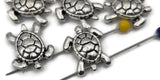 These turtle 2‑hole slider beads are cast in antique silver with defined shells and smooth contours. Their double‑strand alignment ensures symmetry in bracelets, chokers, or layered necklaces. Lightweight yet substantial, they serve wonderfully as focal elements, structured spacers, or connectors in bohemian, tropical, and ocean‑themed jewelry designs.