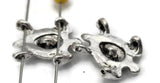 Silver sea turtle 2‑hole slider beads bring ocean motifs to your jewelry designs. Sculpted shell detailing adds texture and shine, while the dual‑channel feature ensures secure alignment in double‑strand projects. Ideal as focal beads, double‑strand spacers, or pendant connectors for boho and coastal jewelry collections.