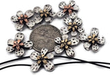 These bright silver flower 2‑hole slider beads feature layered petals with warm copper and gold centers for a stunning mixed‑metal effect. The reflective finish and dual threading holes make them perfect for double‑strand bracelets, chokers, or necklaces. Lightweight yet detailed, they add floral sophistication to boho, romantic, or nature‑inspired jewelry designs.