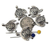 These bright silver sea turtle 2‑hole slider beads feature intricate Celtic knot shells symbolizing unity, harmony, and eternity. With detailed flippers and a polished finish, they align perfectly in double‑strand bracelets, chokers, or necklaces. Durable and beautifully crafted, they’re ideal for coastal, spiritual, or boho jewelry inspired by ocean life and timeless strength.