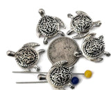 Celtic‑inspired silver turtle 2‑hole slider beads with finely carved knot shells and realistic flippers. The double‑hole structure ensures stability and symmetry in bracelets or necklaces. Use them as focal points or spacers for boho, beach, or spiritual jewelry celebrating life’s journey and the wisdom of the sea turtle.