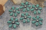 Add concho-inspired charm with these 2-hole flower slider beads. The western design features teardrop turquoise-look petals and beaded silver outlines. Thread through two holes to stabilize leather strips, paracord, or seed bead bands. Perfect for hatbands, stacked bracelets, chokers, and ranch-ready accessories. Essential 2-hole slider beads for Southwestern jewelry making.